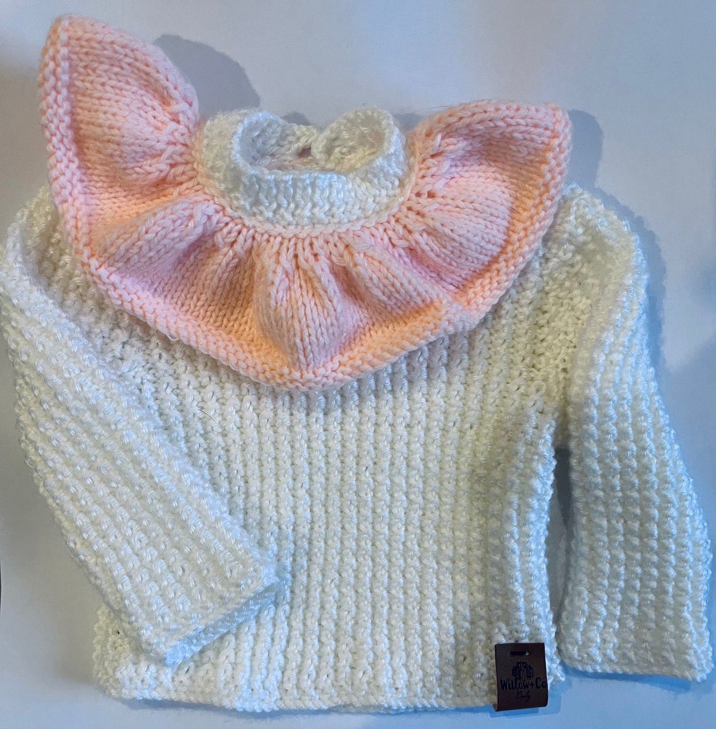 HAND KNITTED JUMPER - WHITE WITH PEACH FRILL