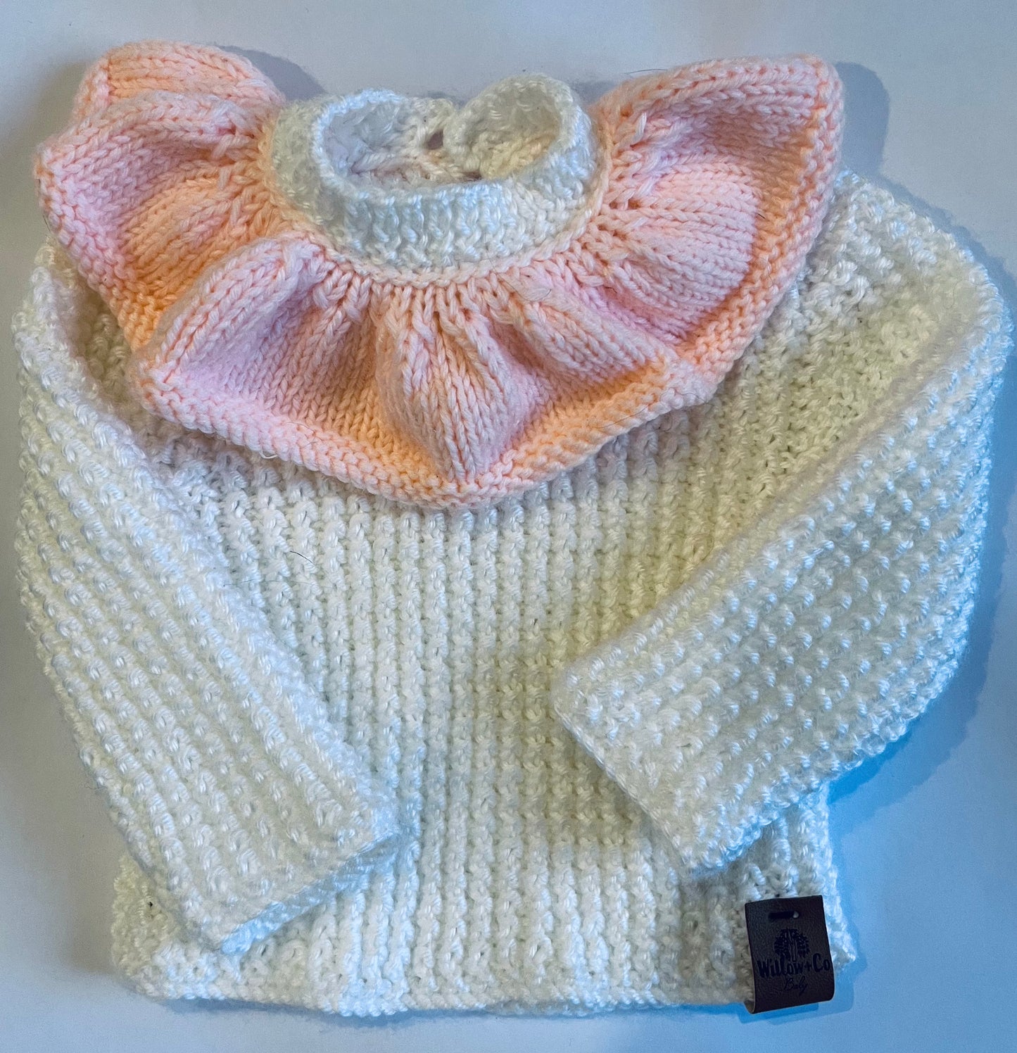 HAND KNITTED JUMPER - WHITE WITH PEACH FRILL